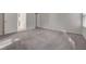 Bedroom showcasing two doorways, neutral paint and carpet, and ample natural light at 3417 Steppe St, North Las Vegas, NV 89032