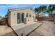 Rear exterior of the house featuring a stucco wall and concrete patio at 3417 Steppe St, North Las Vegas, NV 89032