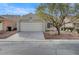 Charming single-story home featuring a two-car garage and desert landscaping at 3417 Steppe St, North Las Vegas, NV 89032