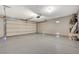 Spacious garage with sealed concrete floor, water heater, and automatic door at 3417 Steppe St, North Las Vegas, NV 89032