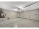 Spacious garage with sealed concrete floor, water heater, and automatic door at 3417 Steppe St, North Las Vegas, NV 89032