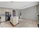 Kitchen featuring black appliances, light cabinetry and tan flooring at 3417 Steppe St, North Las Vegas, NV 89032