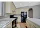 Bright kitchen featuring black appliances and neutral tone cabinetry at 3417 Steppe St, North Las Vegas, NV 89032