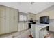 Bright kitchen with white cabinets, black appliances and window over the sink at 3417 Steppe St, North Las Vegas, NV 89032