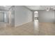 Open living space boasts neutral walls, tile floors, and an archway to another room at 3417 Steppe St, North Las Vegas, NV 89032