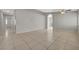 Spacious living room with neutral gray walls, tile flooring, and ample natural light at 3417 Steppe St, North Las Vegas, NV 89032