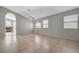 Bright living room with tiled floors, neutral walls, and a view into other rooms at 3417 Steppe St, North Las Vegas, NV 89032