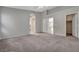 Bright carpeted main bedroom with doorways to the closet and bathroom at 3417 Steppe St, North Las Vegas, NV 89032