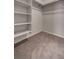 Walk-in closet featuring carpet and built-in shelving at 3417 Steppe St, North Las Vegas, NV 89032