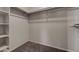 Walk-in closet featuring carpet and built in storage shelves at 3417 Steppe St, North Las Vegas, NV 89032