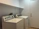 Convenient laundry room with washer, dryer, and additional storage space at 3433 Nebaum Ct, North Las Vegas, NV 89032