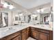 Spacious bathroom with dual sinks and a large mirror, offering functionality and style at 353 Seine Way # 0, Henderson, NV 89014