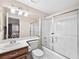 Bright bathroom featuring a shower over tub with sliding glass doors and ample counter space at 353 Seine Way # 0, Henderson, NV 89014