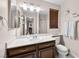 The bathroom features a single sink vanity with decorative lighting, and a shower and toilet at 353 Seine Way # 0, Henderson, NV 89014