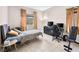 Bedroom featuring neutral walls, tile floors, and a small desk set-up with a queen sized bed at 353 Seine Way # 0, Henderson, NV 89014