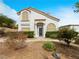 Charming two-story home with a desert landscape and an arched entryway at 353 Seine Way # 0, Henderson, NV 89014