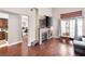 Bright living room with a stone fireplace and views to the kitchen at 353 Seine Way # 0, Henderson, NV 89014