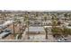 Aerial view of the house with palm trees, a fenced front yard, and a residential street at 4213 Hayes Pl, Las Vegas, NV 89107