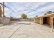 Spacious backyard with a covered patio and block wall at 4213 Hayes Pl, Las Vegas, NV 89107