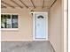 Covered entry featuring a white front door with a window accent at 4213 Hayes Pl, Las Vegas, NV 89107