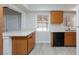 Open kitchen with laminate floors, white quartz countertops, and stainless steel appliances at 4213 Hayes Pl, Las Vegas, NV 89107