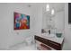 Stylish bathroom with a modern vanity and framed painting at 4471 Dean Martin Dr # 1202, Las Vegas, NV 89103
