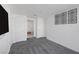 Carpeted bedroom featuring geometric decor and access to an ensuite bath at 4471 Dean Martin Dr # 1202, Las Vegas, NV 89103