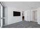 Comfortable bedroom features carpet, television, and doors to other rooms at 4471 Dean Martin Dr # 1202, Las Vegas, NV 89103