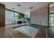 Contemporary hot tub area with wooden accents, stone wall, sheer curtains and relaxing ambiance at 4471 Dean Martin Dr # 1202, Las Vegas, NV 89103