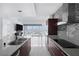Open concept kitchen features an island and views of the city skyline at 4471 Dean Martin Dr # 1202, Las Vegas, NV 89103