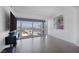 Bright living room with hardwood floors and stunning city views from the large windows at 4471 Dean Martin Dr # 1202, Las Vegas, NV 89103