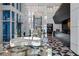 Luxurious lobby with elegant decor, modern seating, floral arrangements, and unique flooring at 4471 Dean Martin Dr # 1202, Las Vegas, NV 89103