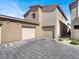 Charming townhome with attached two-car garage and stylish paved driveway at 4472 Sapphire Moon Ave, North Las Vegas, NV 89084