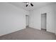 Bright bedroom with a ceiling fan, neutral carpet, and multiple entryways offers flexibility and style at 470 Dorchester Bend Ave # 3, North Las Vegas, NV 89032
