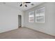 Spacious bedroom with natural light, ceiling fan, and closet offers a comfortable and practical design at 470 Dorchester Bend Ave # 3, North Las Vegas, NV 89032
