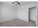 Neutral carpeted bedroom with ceiling fan and adjacent doorway, creating a comfortable retreat at 470 Dorchester Bend Ave # 3, North Las Vegas, NV 89032