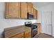 Well-equipped kitchen with stainless steel appliances, gas range and ample counter space at 470 Dorchester Bend Ave # 3, North Las Vegas, NV 89032
