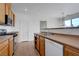 Kitchen with ample cabinets, stainless steel appliances, and easy access to dining area at 470 Dorchester Bend Ave # 3, North Las Vegas, NV 89032