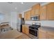 Well-equipped kitchen with stainless steel appliances, gas range and ample counter space at 470 Dorchester Bend Ave # 3, North Las Vegas, NV 89032