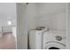 Convenient laundry room features a Samsung washer and dryer and storage shelves at 470 Dorchester Bend Ave # 3, North Las Vegas, NV 89032