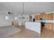 Spacious living area with open kitchen featuring stainless steel appliances and ceiling fan at 470 Dorchester Bend Ave # 3, North Las Vegas, NV 89032