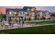 Townhome with multiple balconies, well-maintained landscaping, and a pleasant outdoor picnic area at 474 Ylang Pl # Lot 7, Henderson, NV 89015