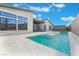 Lush backyard featuring a modern pool, spa, and meticulously landscaped grounds for ultimate relaxation and entertainment at 477 Highview Ridge Ave, Las Vegas, NV 89138