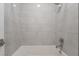 Bright bathroom showcasing clean design with tiled walls, tub, and chrome fixtures at 477 Highview Ridge Ave, Las Vegas, NV 89138