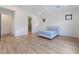 Bright bedroom with wood floors features a ceiling fan, recessed lighting, and ensuite bathroom for added convenience at 477 Highview Ridge Ave, Las Vegas, NV 89138