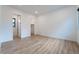 Spacious bedroom with wood floors, natural light, and an ensuite bathroom at 477 Highview Ridge Ave, Las Vegas, NV 89138