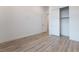 Bright bedroom featuring wood floors, a closet with sliding doors and neutral walls at 477 Highview Ridge Ave, Las Vegas, NV 89138