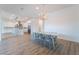 Open-concept dining room leading into the kitchen, featuring wood floors at 477 Highview Ridge Ave, Las Vegas, NV 89138