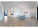 Bright dining room featuring wood floors, white walls, and modern chandelier at 477 Highview Ridge Ave, Las Vegas, NV 89138