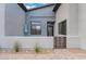 Stylish front porch with a gated entry and desert landscaping at 477 Highview Ridge Ave, Las Vegas, NV 89138